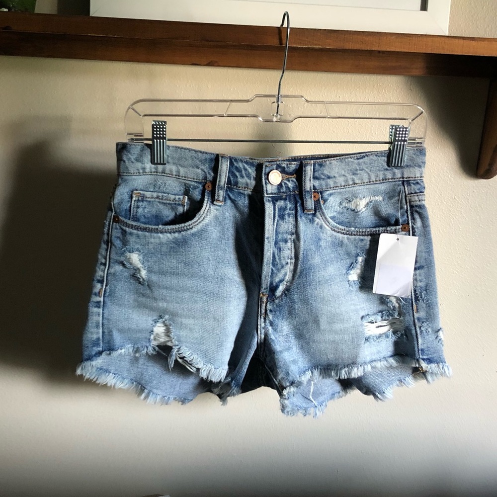 Distressed denim cutoff shorts